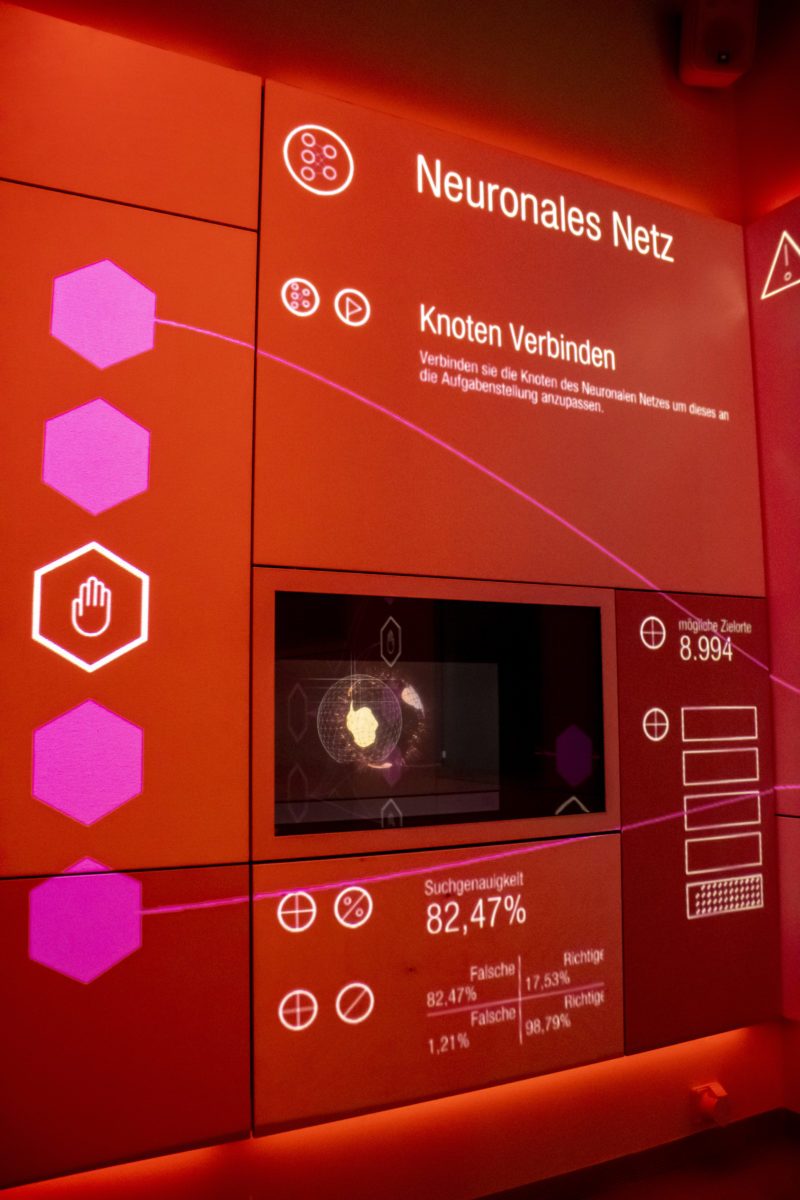 Red projection titled Neural Network – Connect Nodes, with hexagons and 82.47% search accuracy
