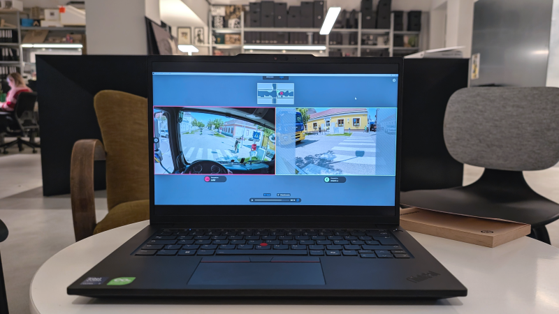 Laptop running the app, comparing a truck driver’s view and a pedestrian’s view of the same crossing